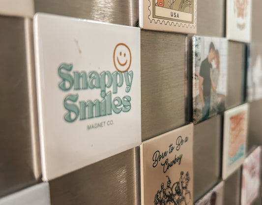 custom designs and images on custom magnets on a fridge